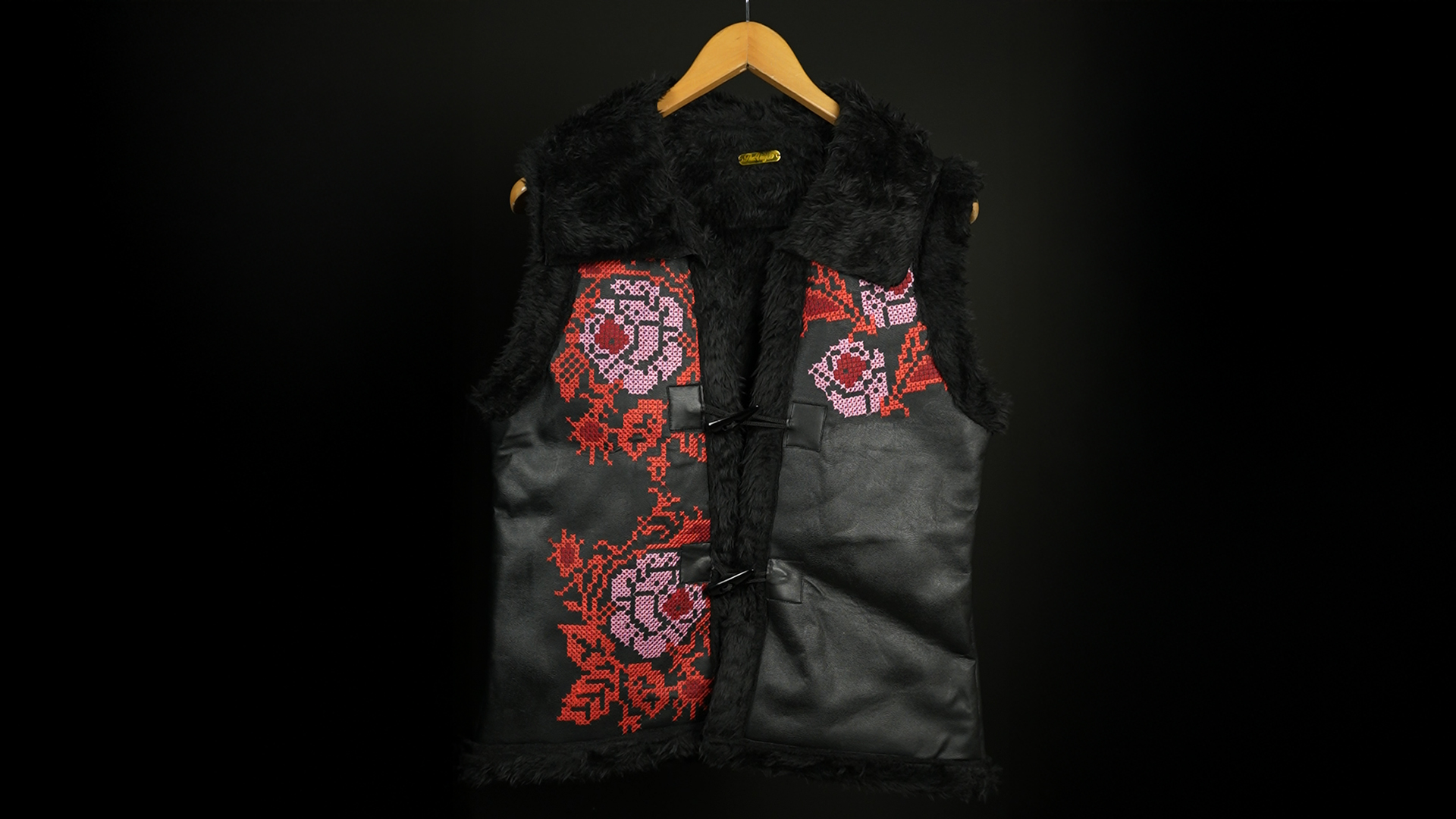 Black faux fur vest with red and pink rose embroidery